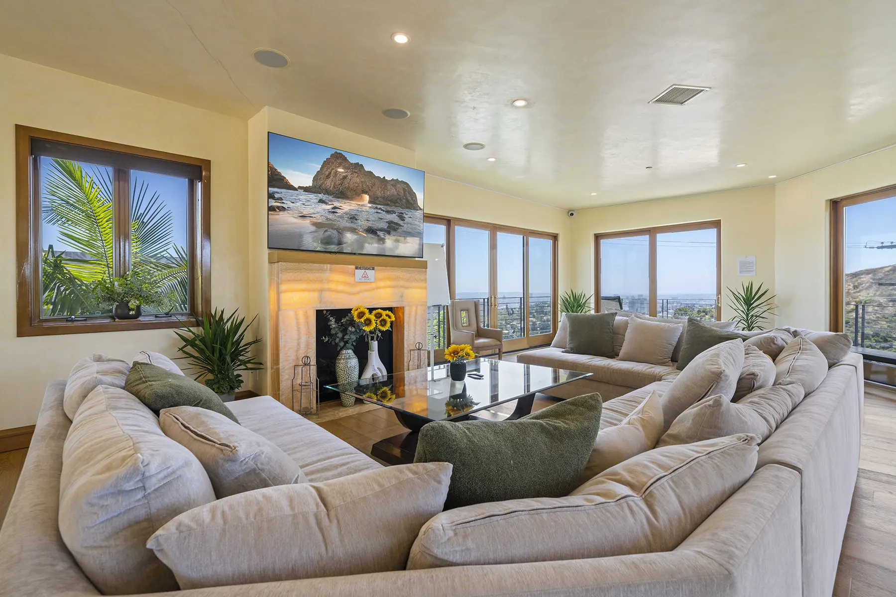 rehab with luxury living room with fireplace and views of los angeles